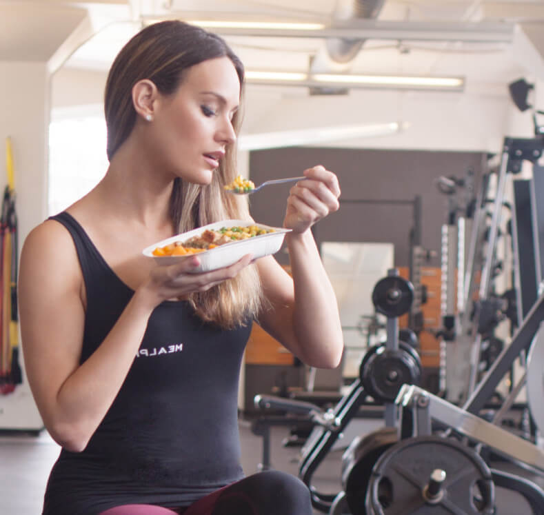 Female Athlete Enjoys the benefits of eating a mealpro meal
