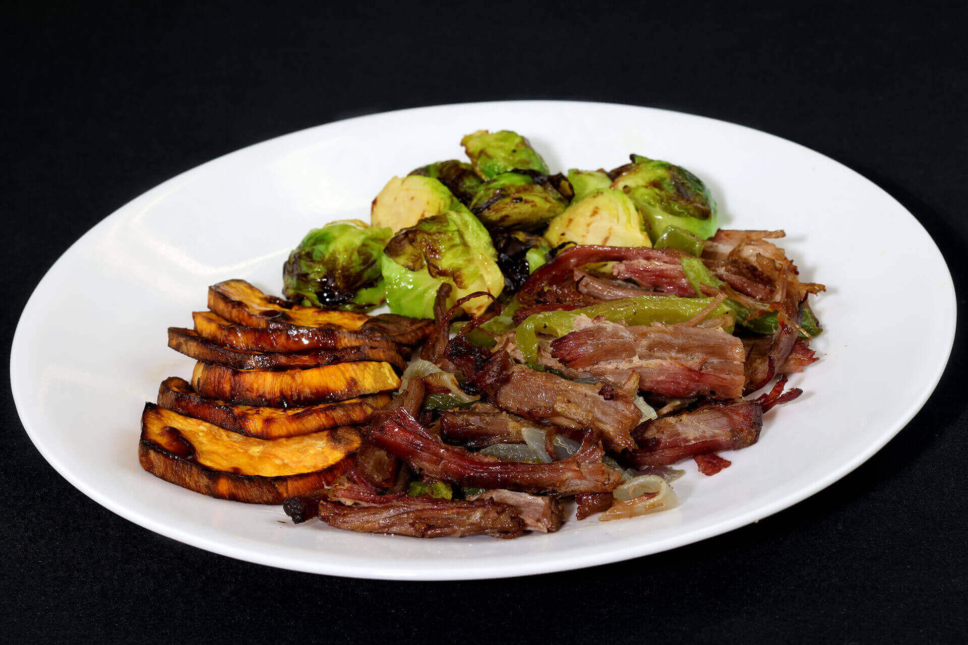 Paleo pulled steak with roasted yams and Brussels sprouts.