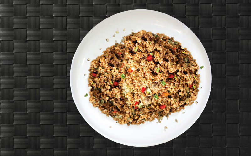 One pound of lean ground turkey on a plate served with cilantro and lemon juice