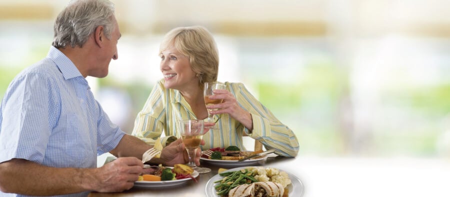 Picture of elderly couple enjoying healthy senior food that require no cooking