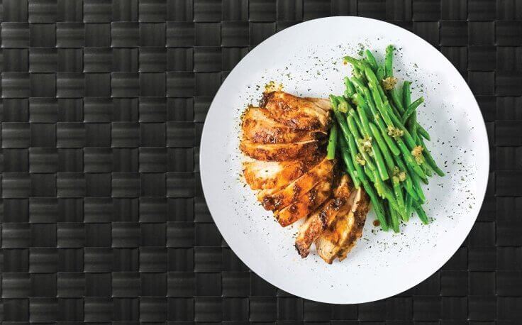 Lean white chicken with a veggie for a tasty paleo meal.