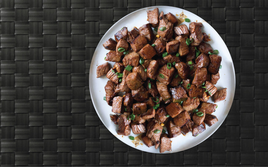 Super juicy flank steak served with garnish for a gourmet paleo meal.