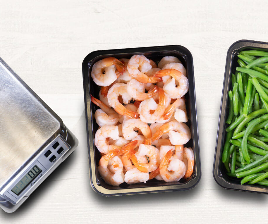 Healthy paleo meals plated in a microwave safe  meal prep containers
