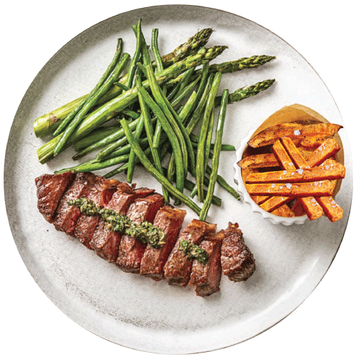 Steak, Yams and Asparagus Spears on a Plate.