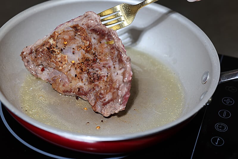 Slice tri-tip in half and sear