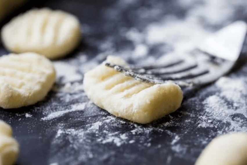 Use your fork and press gently to create the gnocchi lines.