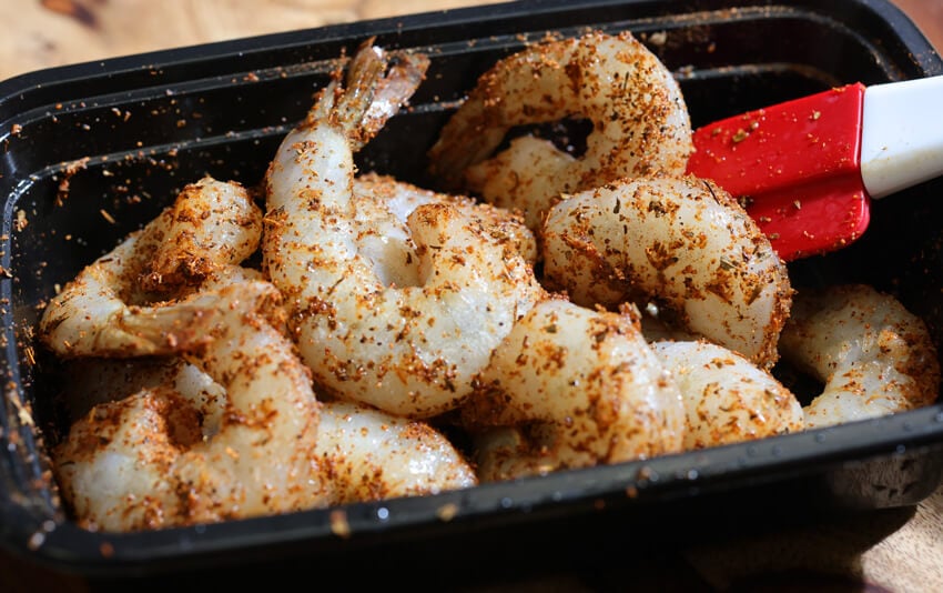 Toss shrimp with seasoning