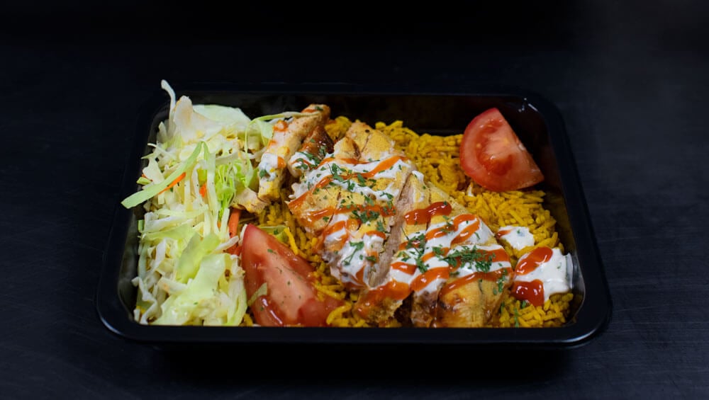 Healthy  halal meals plated in a microwave safe halal meal prep container