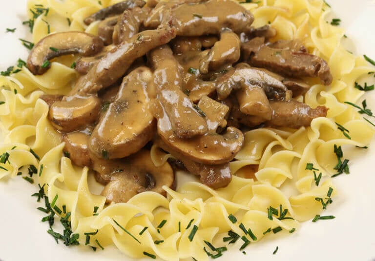 beef stroganoff plated and garnished