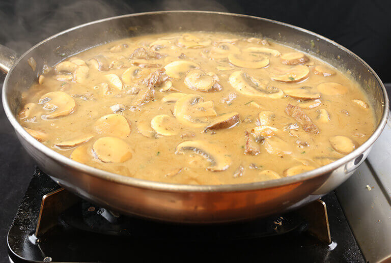 beef stroganoff sauce simmering