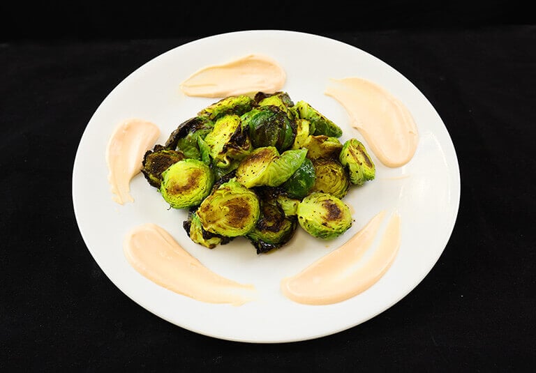 honey balsamic brussels sprout plated and garnished