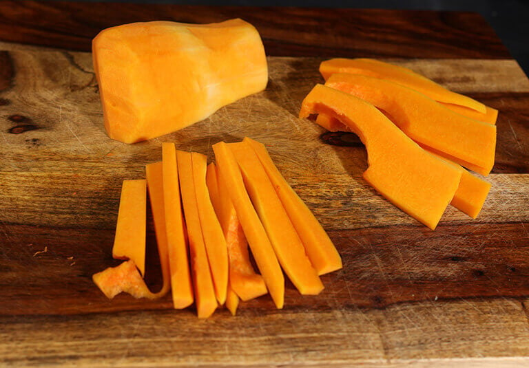 cutting butternut squash into spears