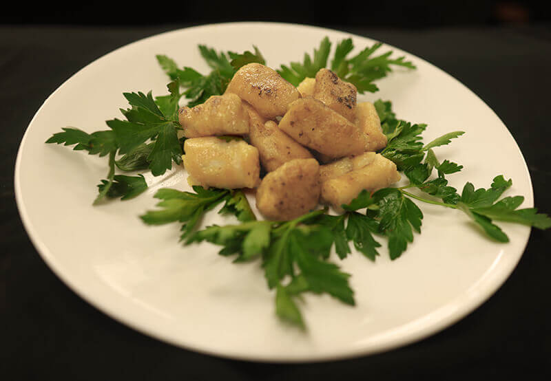 Traditional potato gnocchi plated and garnished