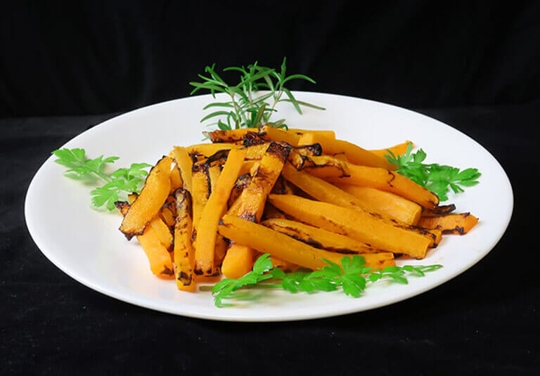 squashed fries plated with garnish