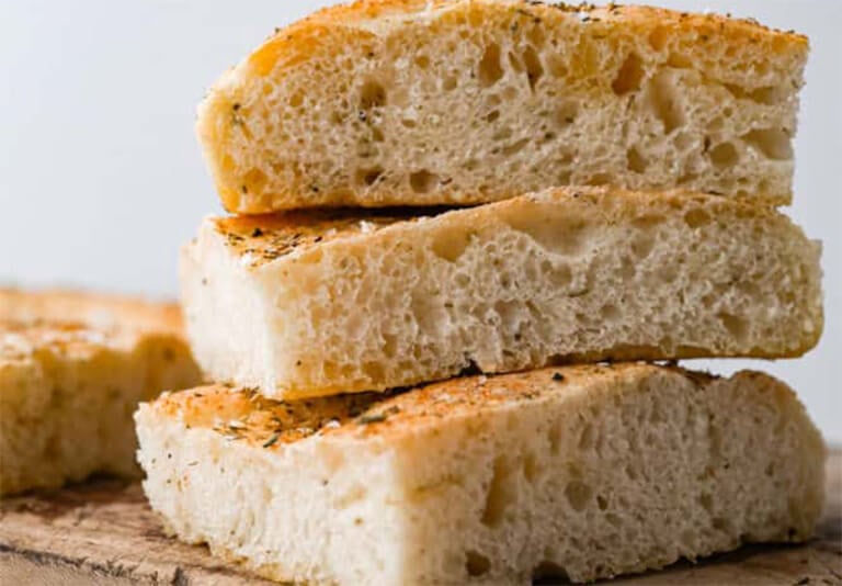 pounding the dough into the baguette shape